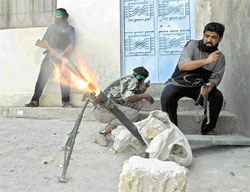 Tirs d'obus de mortier au coeur de Najaf -Photo Reuters-
